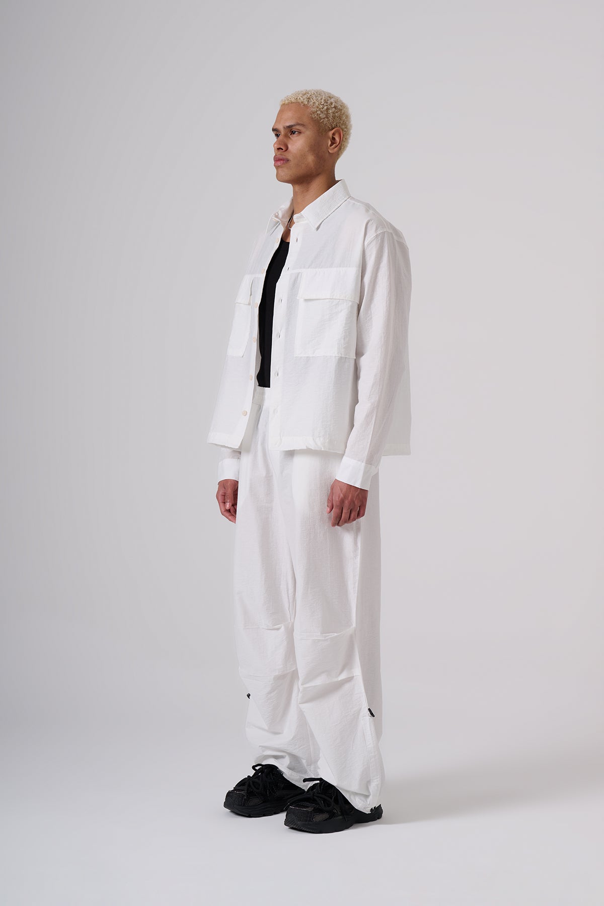 White Oversized Coat & Jackets sets – Minimal Black Embroidered Chest Detail