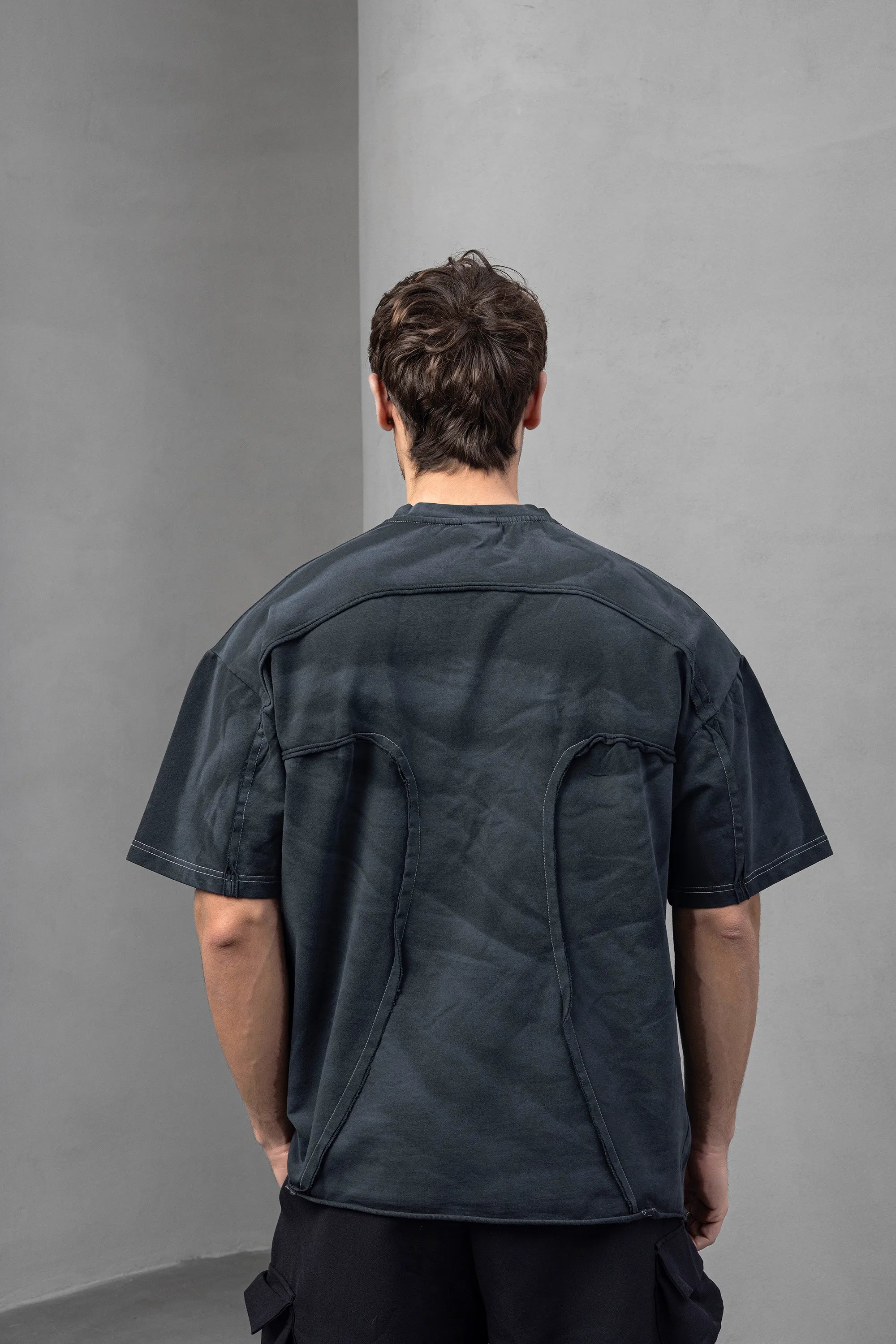 Dark Graphic Tee with Unique Stitch Detailing