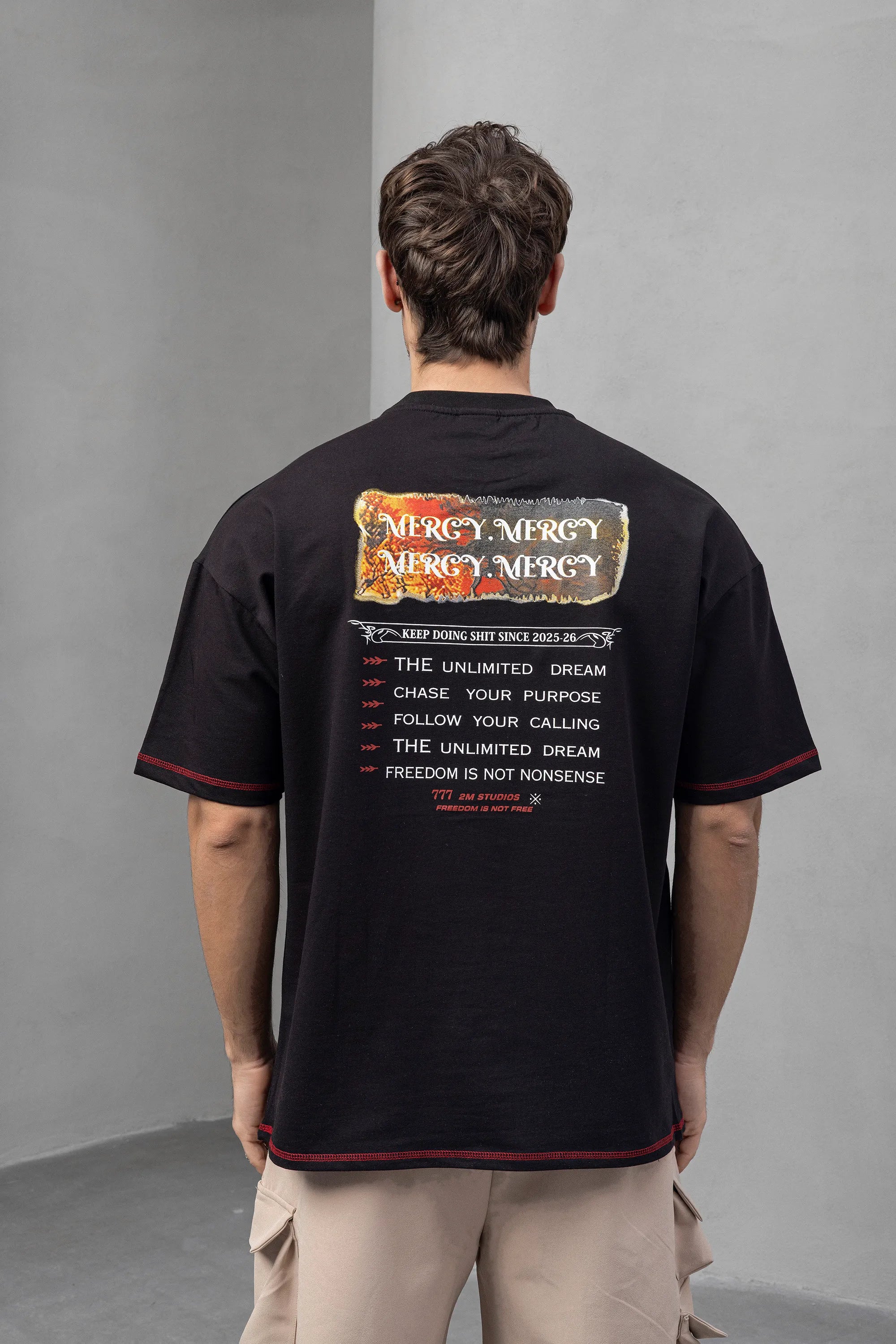 Black Graphic Tee with Bold '77' and Mercy Print