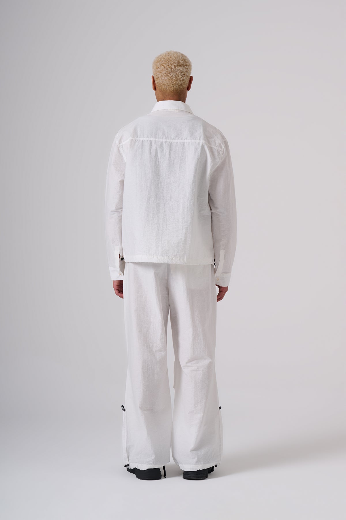 White Oversized Coat & Jackets – Minimal Black Embroidered Chest Detail